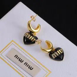 miu miu boucles doreilles pour femme s_1234117